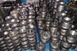 Stitching machine feed wire wheel